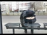 Girl showing her thong waiting at the bus stop